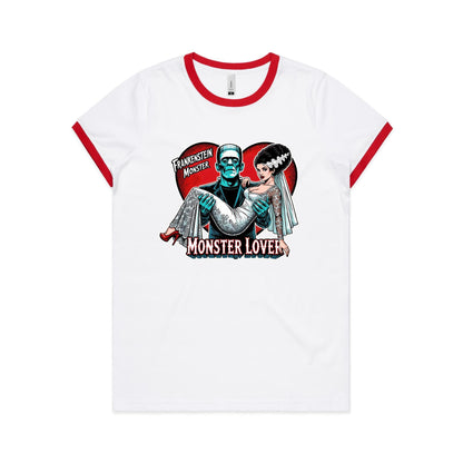 A close-up of a white crew-neck t-shirt featuring a retro Frankenstein-themed graphic print. The design shows a teal-colored Frankenstein Monster carrying a bride in a white lace wedding gown, set against a red heart background with the text 'FRANKENSTEIN MONSTER' and 'MONSTER LOVER'.