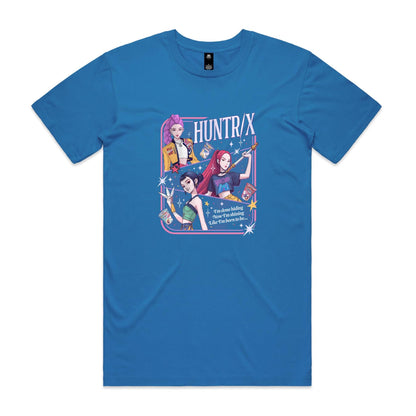 A close-up of a graphic t-shirt featuring three illustrated anime-style female characters with colorful hair and outfits, surrounded by stars and the text 'HUNTR/X'.