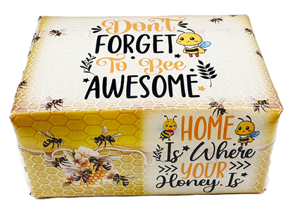 A rectangular decorative box with a honeycomb pattern and cartoon bees, printed with the phrases “Don't Forget To Bee Awesome” and “Home Is Where Your Honey Is.” on a white background.