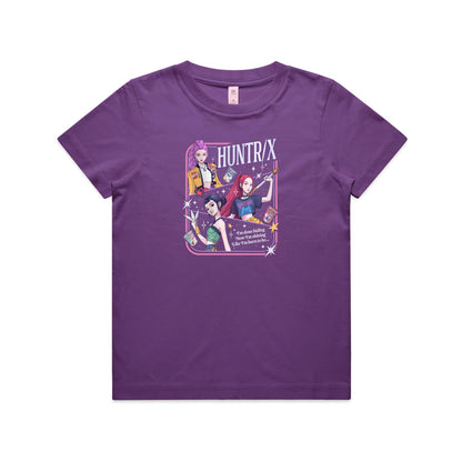 A close-up of a graphic t-shirt featuring three illustrated anime-style female characters with colorful hair and outfits, surrounded by stars and the text 'HUNTR/X'.