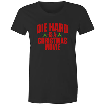 A black women's t-shirt with the text 'DIE HARD IS A CHRISTMAS MOVIE' printed in red and white.