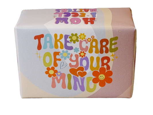 A square product box with a retro 1960s-style design featuring the text 'TAKE CARE OF YOUR MIND' in colorful retro letters with flowers and hearts, on a white background.