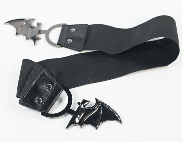 Black belt with bat-shaped buckle on a white background