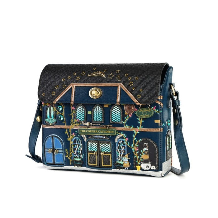 A navy blue crossbody handbag featuring a highly detailed, colorful illustration of 'The Corner Cafe' from The Great Gatsby, with a black textured flap and gold hardware, shown on a white background.