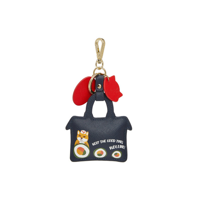Keychain with a small bag design featuring a cat and sushi, on a white background.