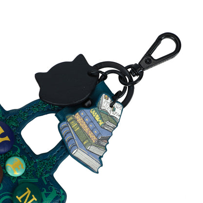 Colorful keychain with a book design and black carabiner on a white background
