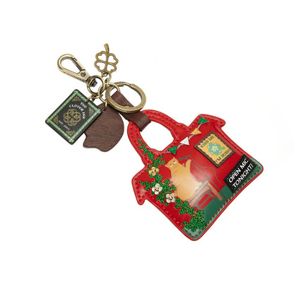 Red teapot-shaped keychain with a cat illustration on a white background