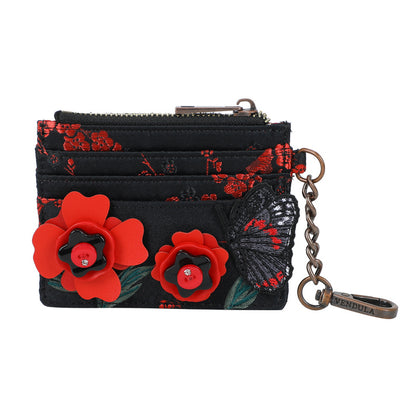 Black wallet with red floral designs and a butterfly, featuring a keychain, on a white background.