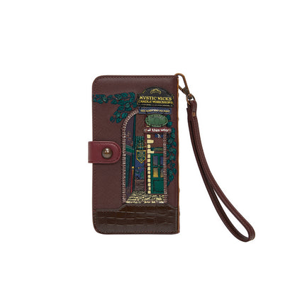 Brown leather wallet with decorative design on a white background