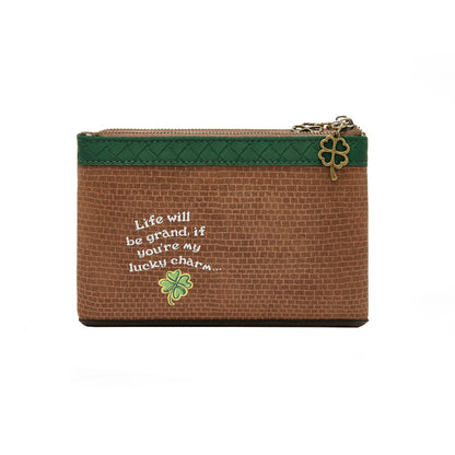 Brown pouch with green zipper and embroidered text and clover design on a white background