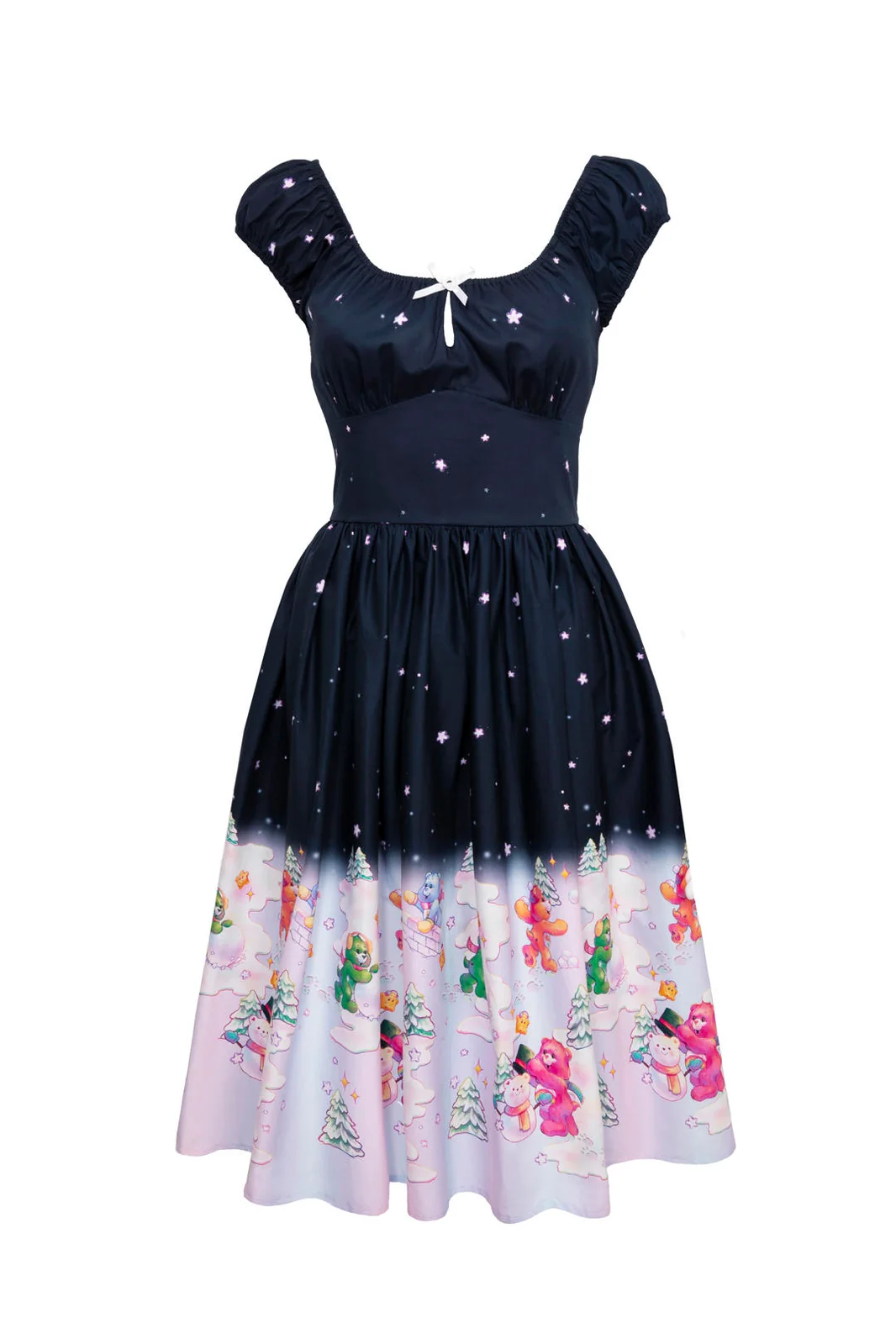 A retro-style A-line dress with a navy blue bodice fading into a light pink and white patterned hem. The bodice features a starry print, puff sleeves, and a small white bow at the neckline.