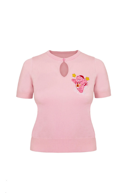A light pink short-sleeve knit top with a keyhole cutout at the collar and a small embroidered cartoon character on the left chest, shown on a plain white background.