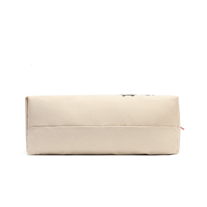 A rectangular canvas pouch in a light beige color, featuring a small black graphic on the top right and a tiny red zipper pull, shown against a plain white background.