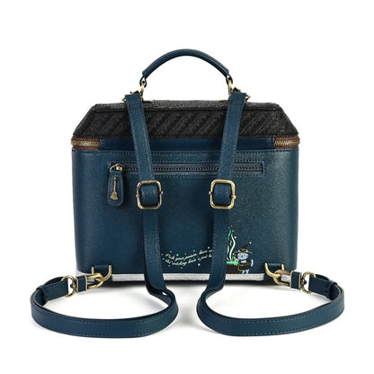 A navy blue leather handbag with a textured black and gray patterned top, gold-tone hardware, a top handle, and a detachable shoulder strap, shown on a white background.