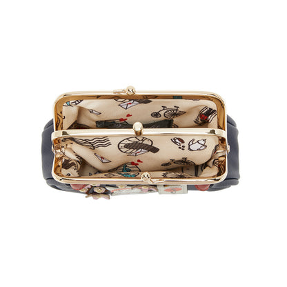 Designer handbag with intricate pattern on a white background