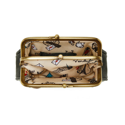Small clutch bag with gold clasp and patterned interior on a white background