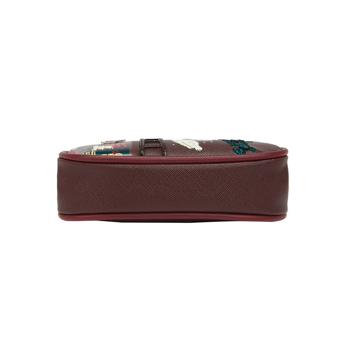 Brown suitcase with floral patterns on a white background
