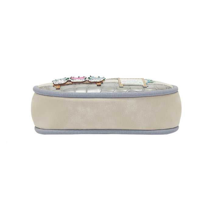 Beige jewelry box with decorative clasp on a white background