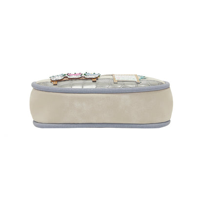 Beige jewelry box with decorative clasp on a white background