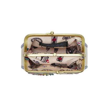 Small gold clutch with patterned interior on a white background