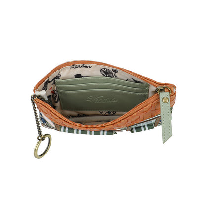 Small orange purse with a keychain on a white background