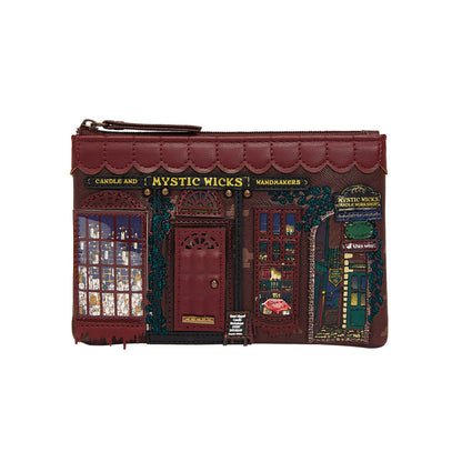 Pouch designed like a store front with 'Mystic Wicks' branding on a white background