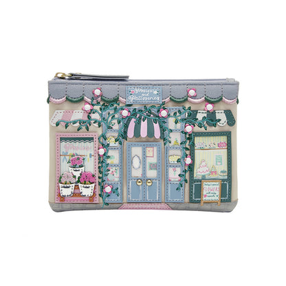 Pouch with a design of a quaint store front on a white background