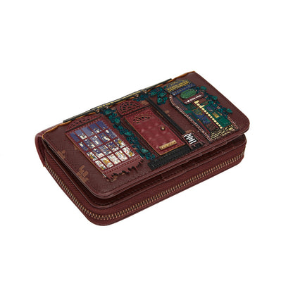 Brown wallet with decorative designs on a white background