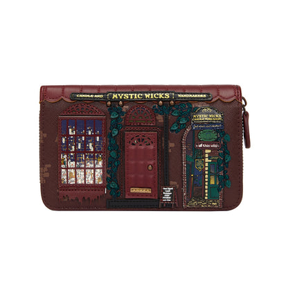 Brown leather wallet with decorative elements and 'Mystic Wicks' branding on a white background