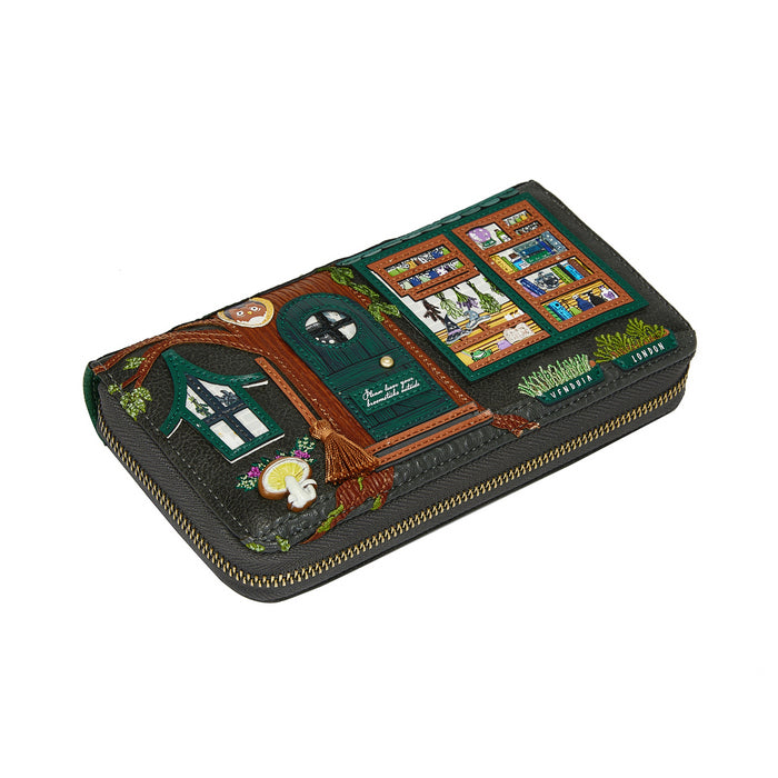 Decorative wallet with a treehouse design on a white background