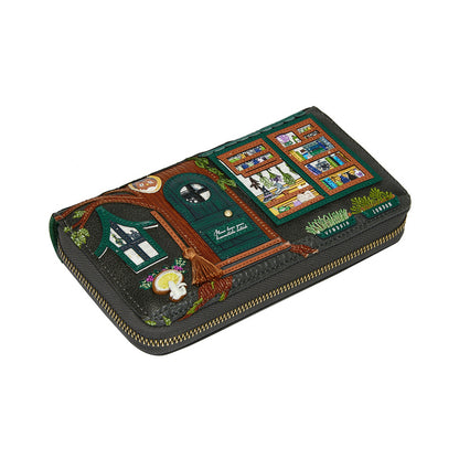 Decorative wallet with a treehouse design on a white background