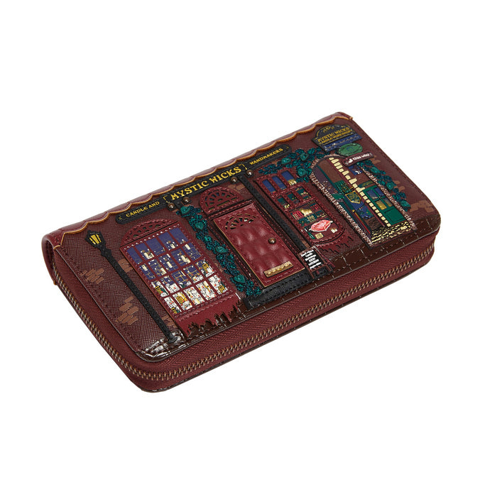 Brown leather wallet with decorative panels on a white background
