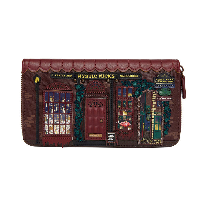 Designer handbag with detailed facade design on a white background