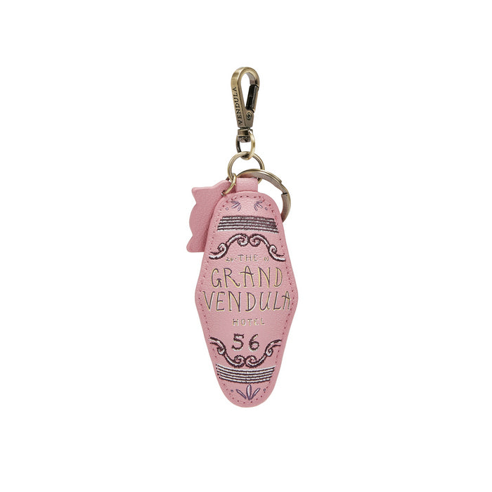 Pink keychain with 'The Grand Vendula Hotel 56' text on a white background