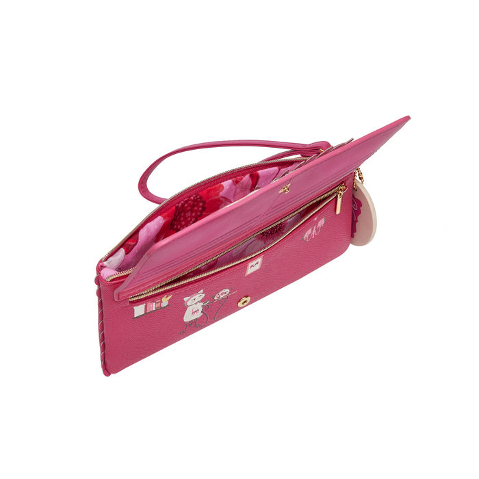 Pink handbag with floral interior on a white background