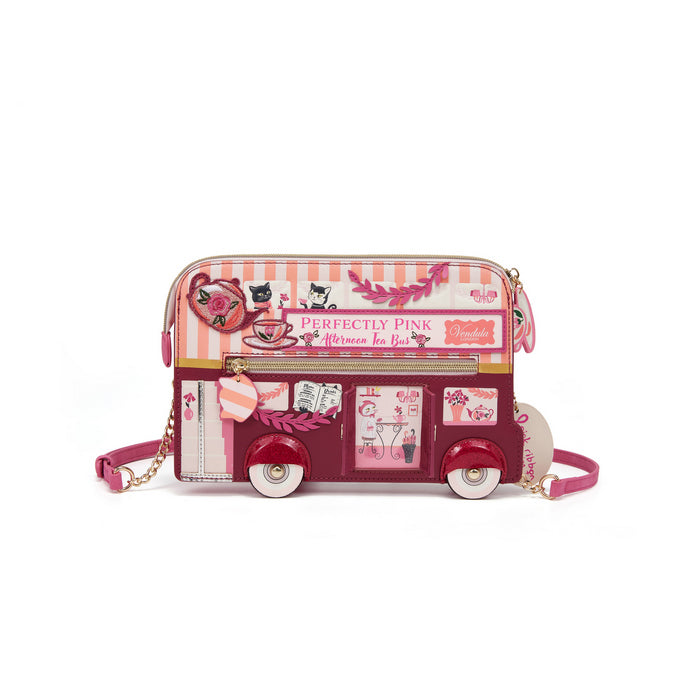 Pink bus-shaped handbag with decorative elements on a white background