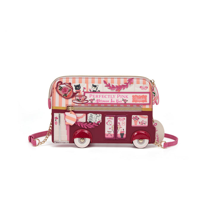 Pink bus-shaped handbag with decorative elements on a white background