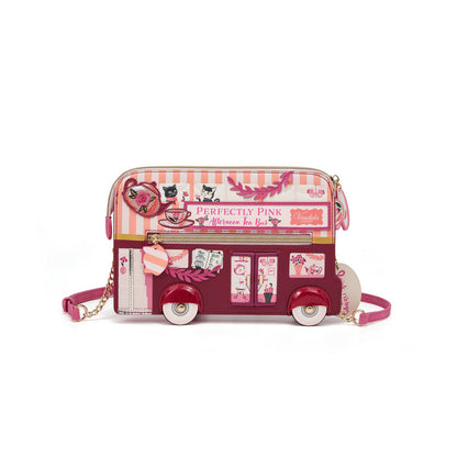 Pink bus-shaped handbag with decorative elements on a white background