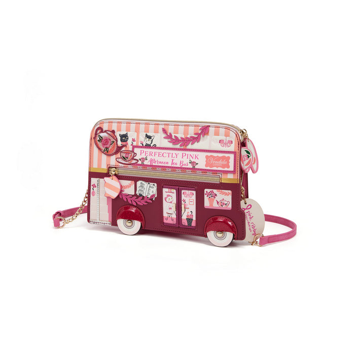 Pink double-decker bus-shaped handbag with decorative elements on a white background