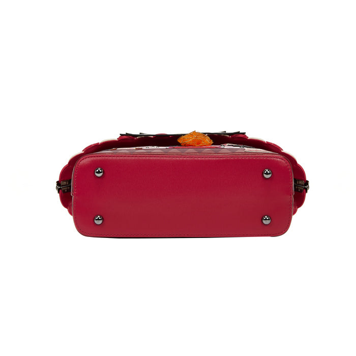 Red handbag with decorative elements on a white background