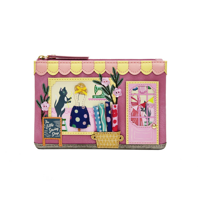 Pink wallet with colorful design on a white background