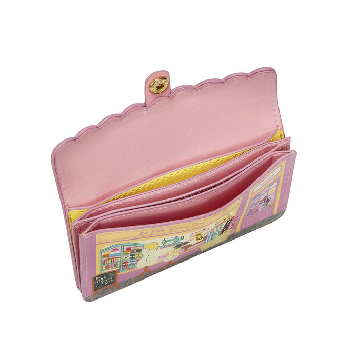 Pink wallet with colorful interior on a white background