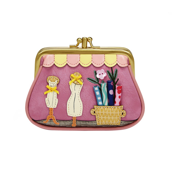 Pink purse with decorative elements on a white background