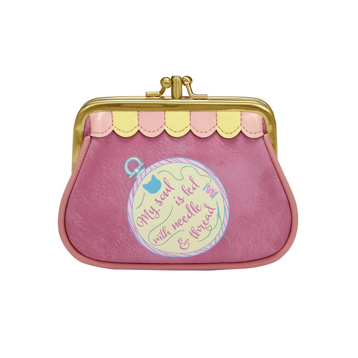 Pink coin purse with gold clasp and embroidered design on a white background