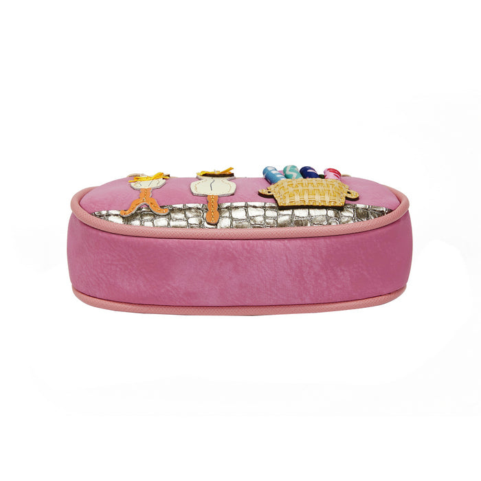 Pink jewelry box with decorative charms on a white background