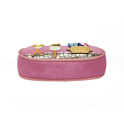 Pink jewelry box with decorative charms on a white background