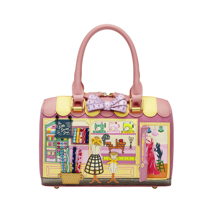 Pink handbag with colorful design on a white background