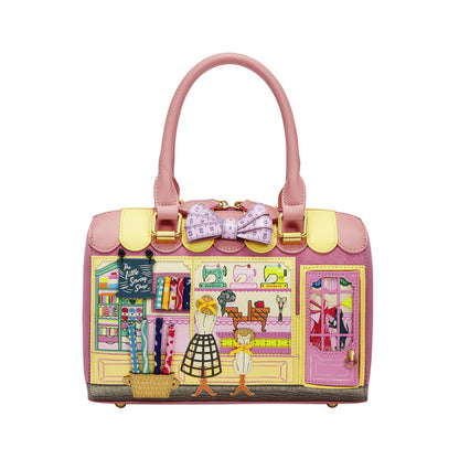 Pink handbag with a detailed design of a clothing store on a white background