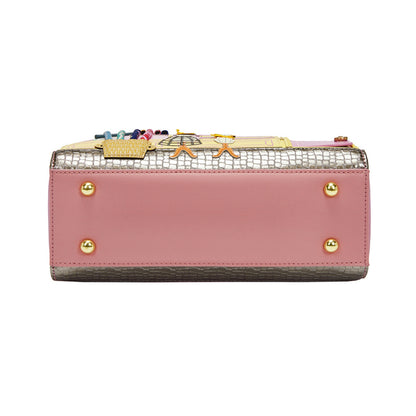 Pink wallet with decorative accents on a white background