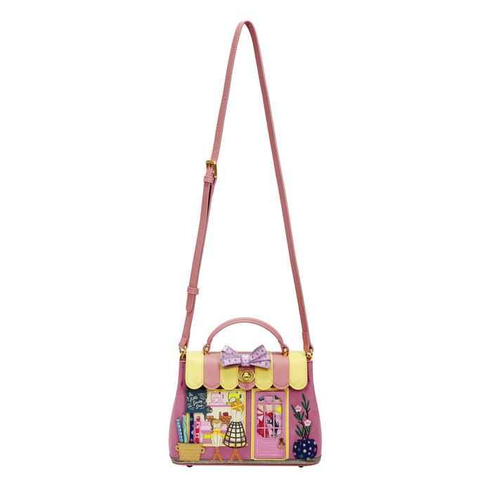 Pink handbag with a colorful design on a white background